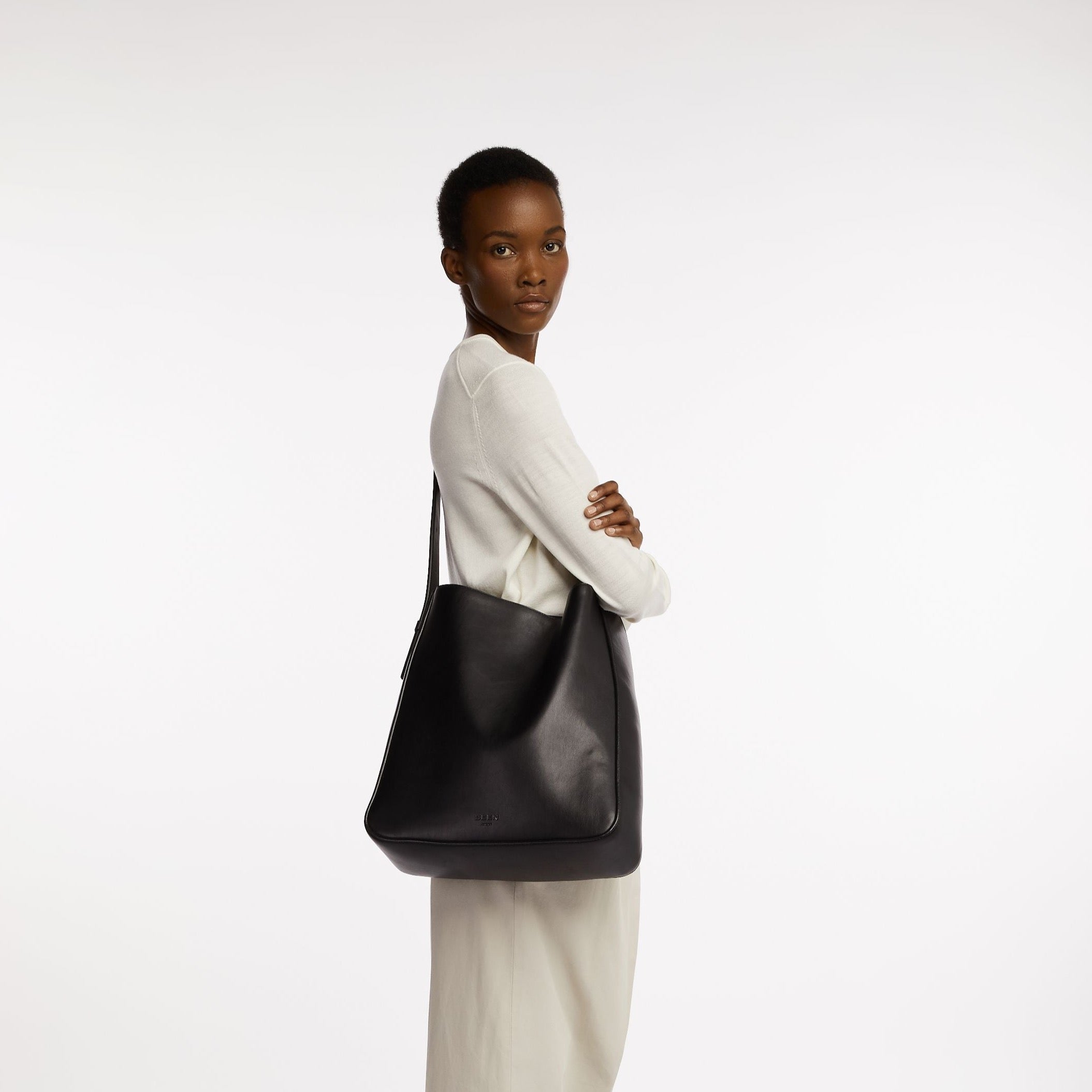 Rowe Tote in Black Onyx on model as a sling