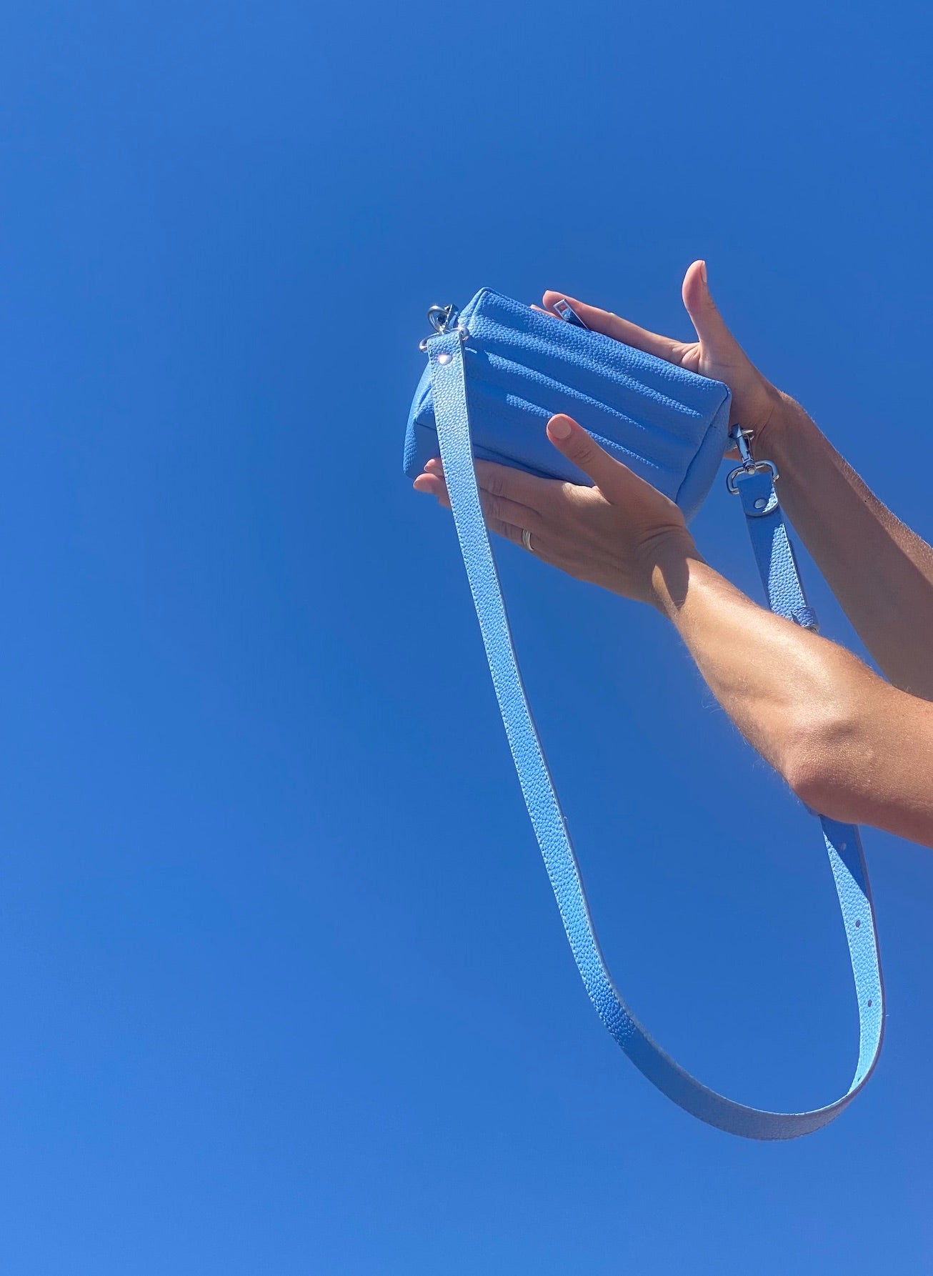 Ridley Crossbody in Forget-Me-Not held by model
