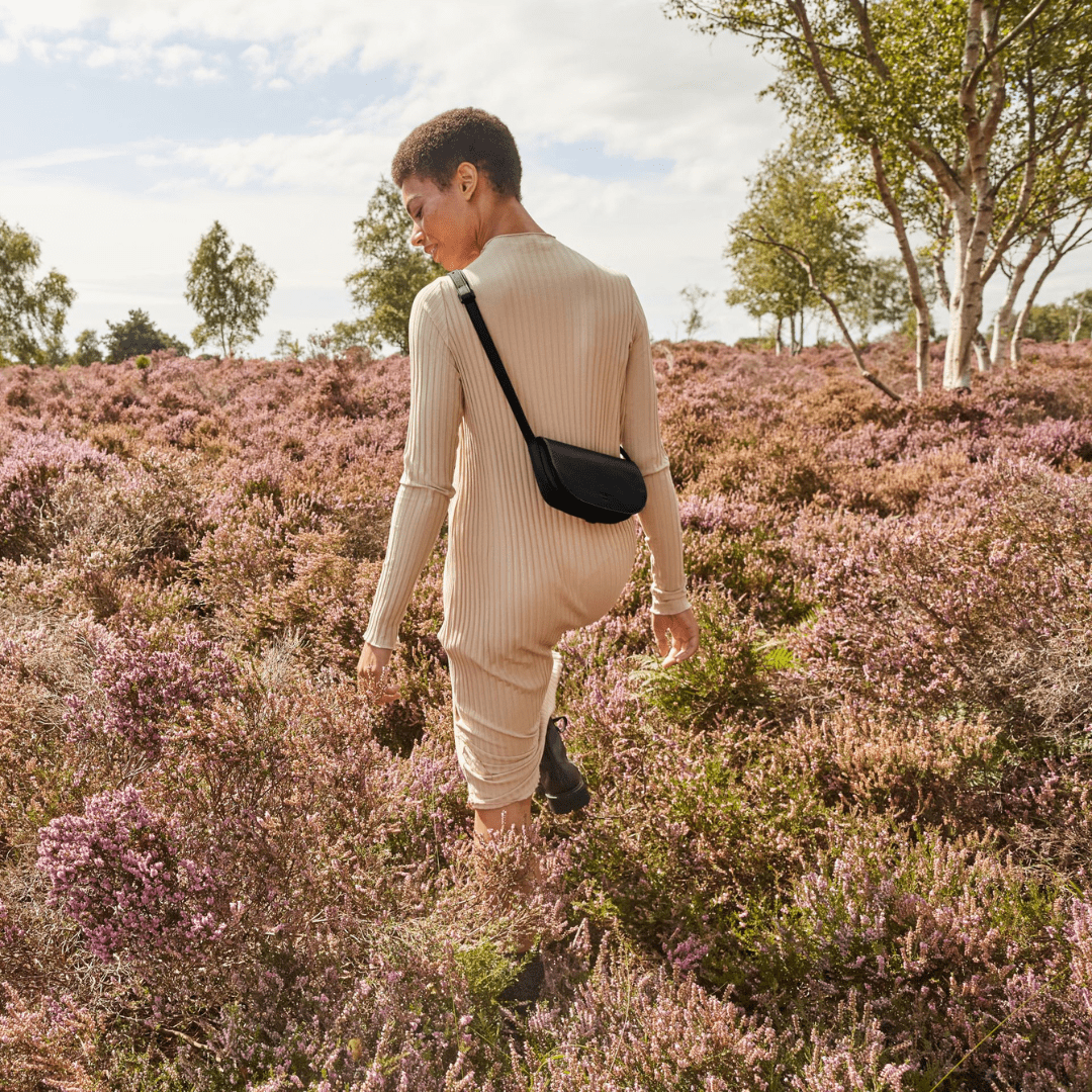 Our Mini Millais bag in Vegan Appleskin leather alternative on model as a cross body 