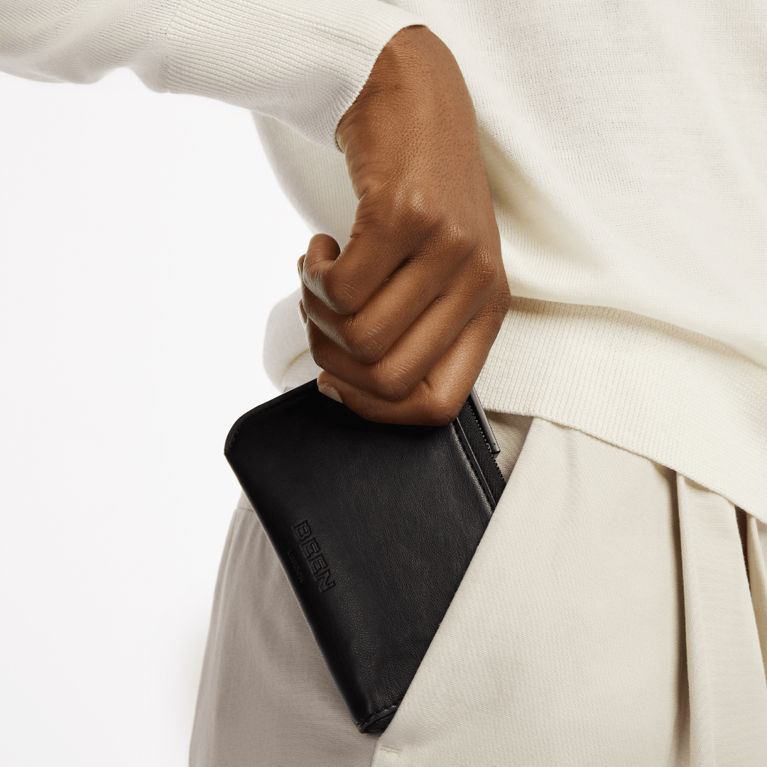 Jude Card Holder in Black Onyx fitting in pocket of model trousers 